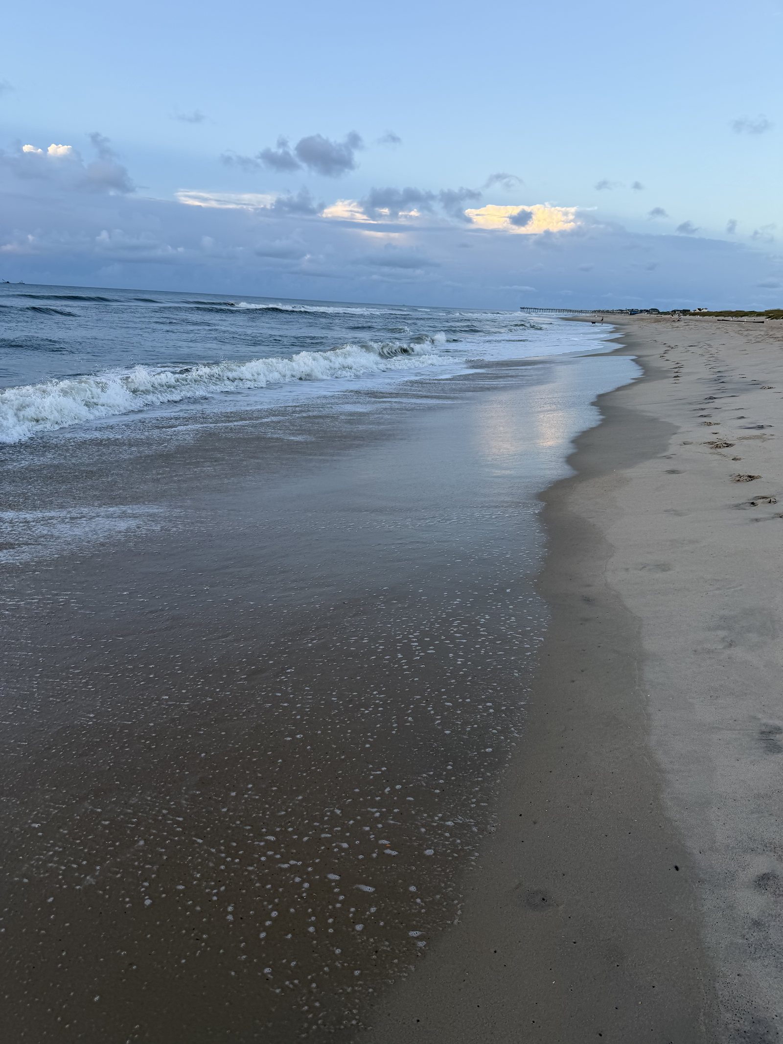 Evening surf and footprints on the Avon beach