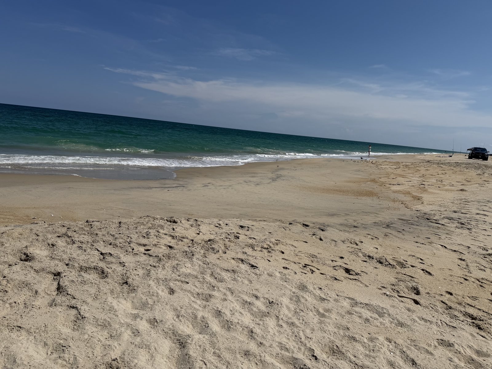 Teal ocean water and clean sand at the Avon beach