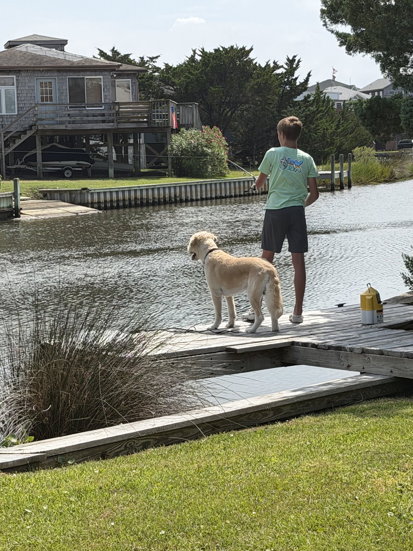 Fishing with the dog off the private canal dock at Lucky Landing