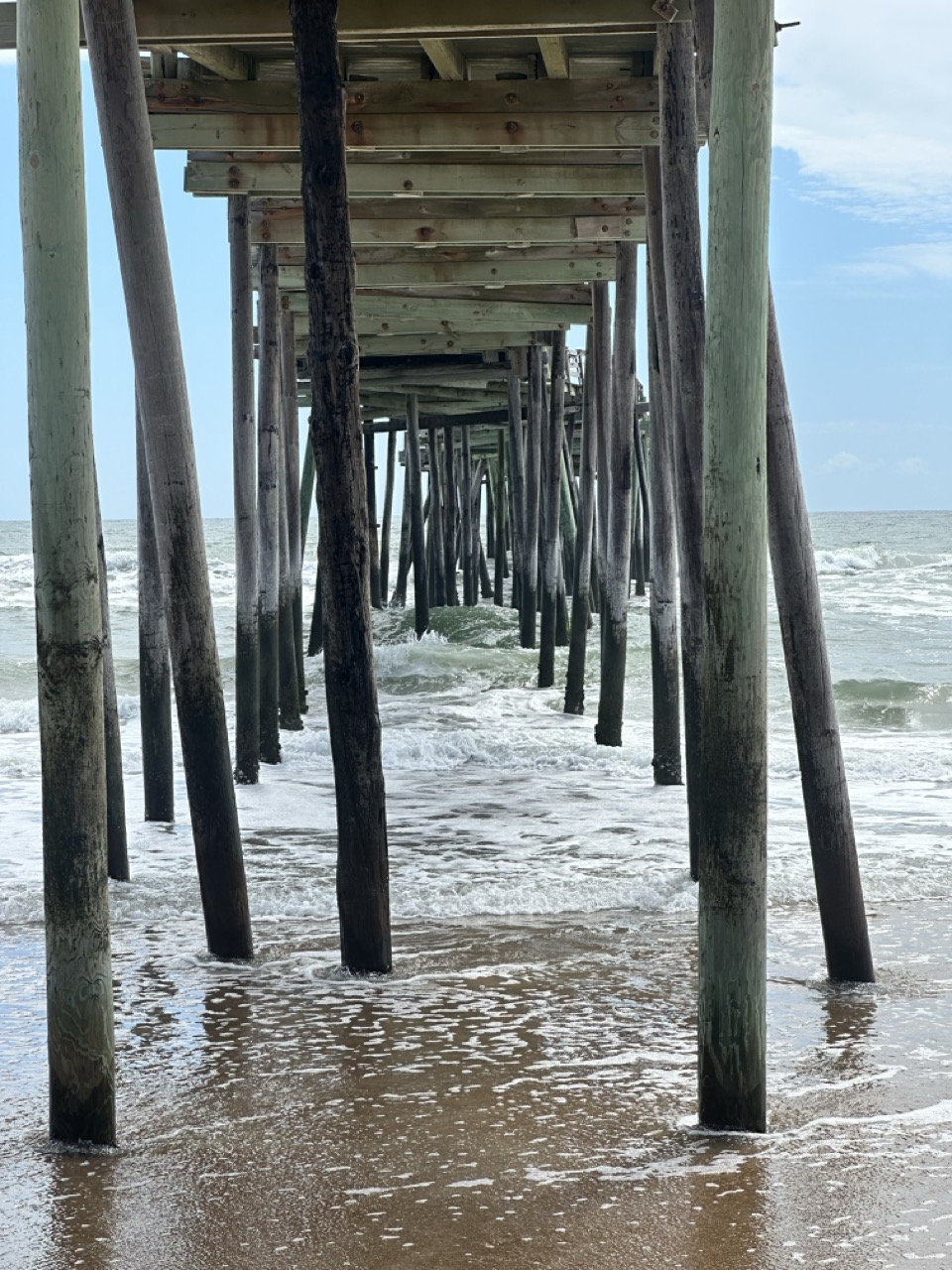 Pilings under the Avon Fishing Pier, where rip currents commonly form